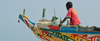 A colourful boat on the water in Senegal. As a Projects Abroad volunteer in Senegal there will be many memorable sights to behold.